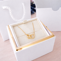 White Box with Gold Necklace